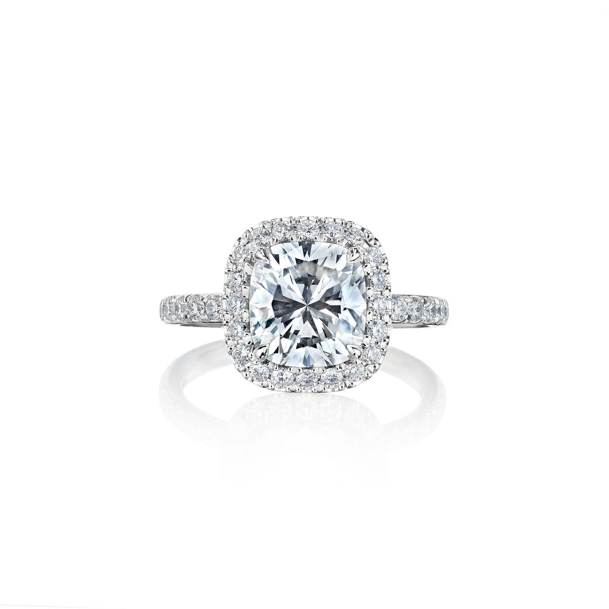 Cushion cut diamond engagement ring with pavé halo by Marina Fragoso