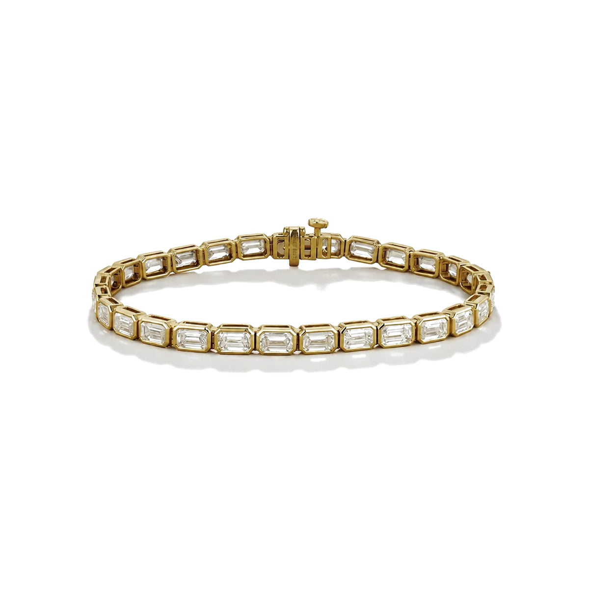 Bezel set emerald cut diamond tennis bracelet in 18k yellow gold