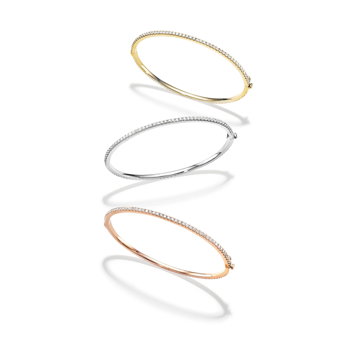 Clarity diamond bangle in 18k yellow, white and rose gold