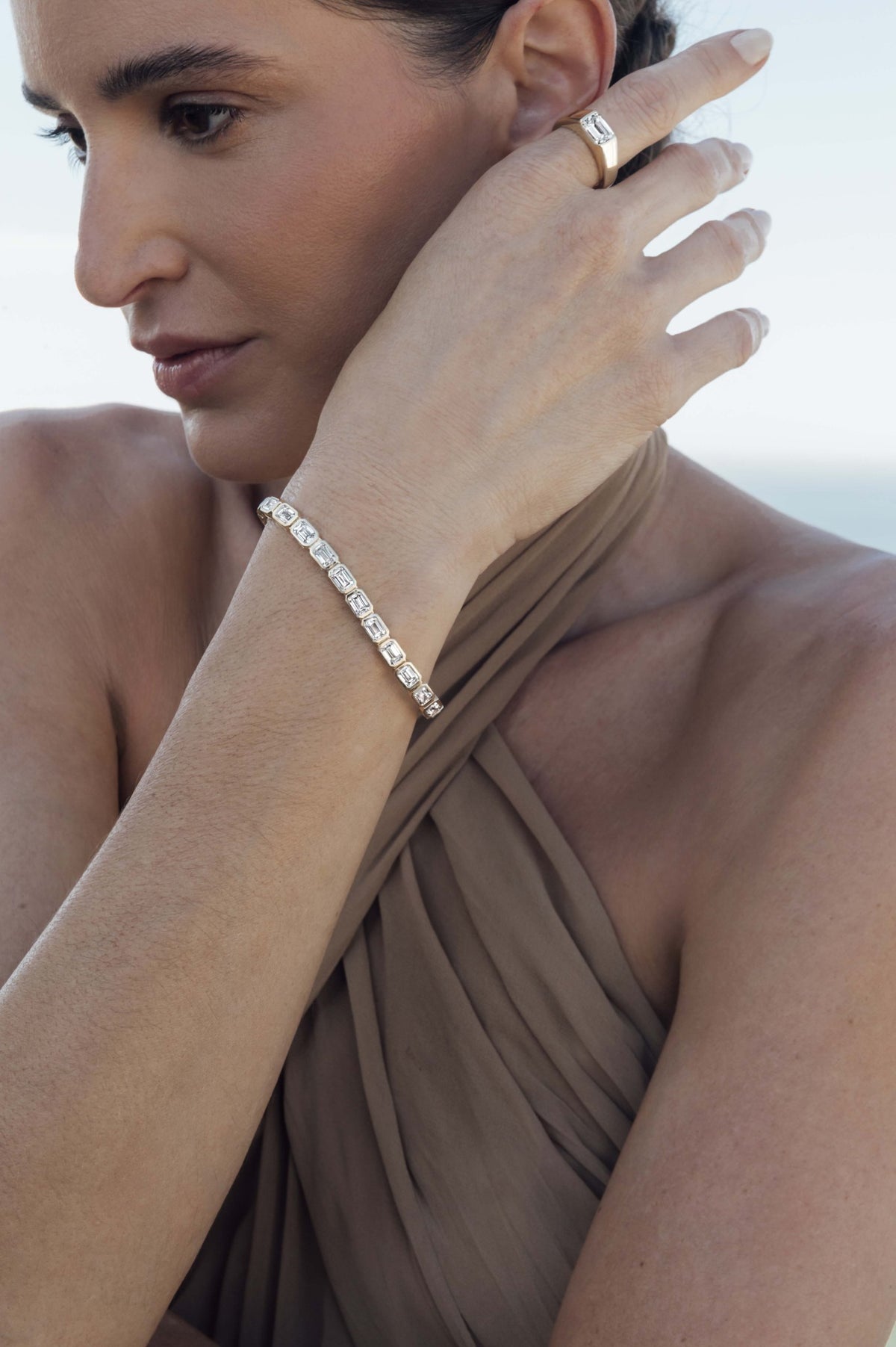 Left: bracelet, Bezel Set Emerald Cut. Right: bracelet, Bezel Set Emerald Cut; ring, East-West Emerald Cut