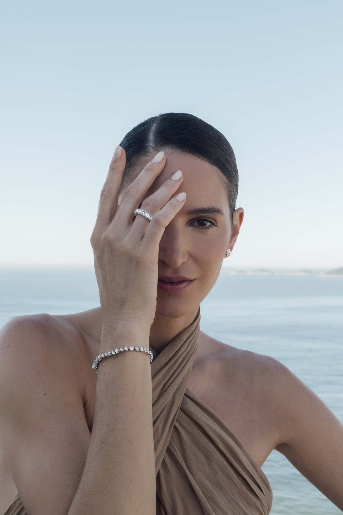 Left: bracelet, Multi-Shape. Right: bracelet, Multi-Shape; ring, Emerald Cut Eternity Band