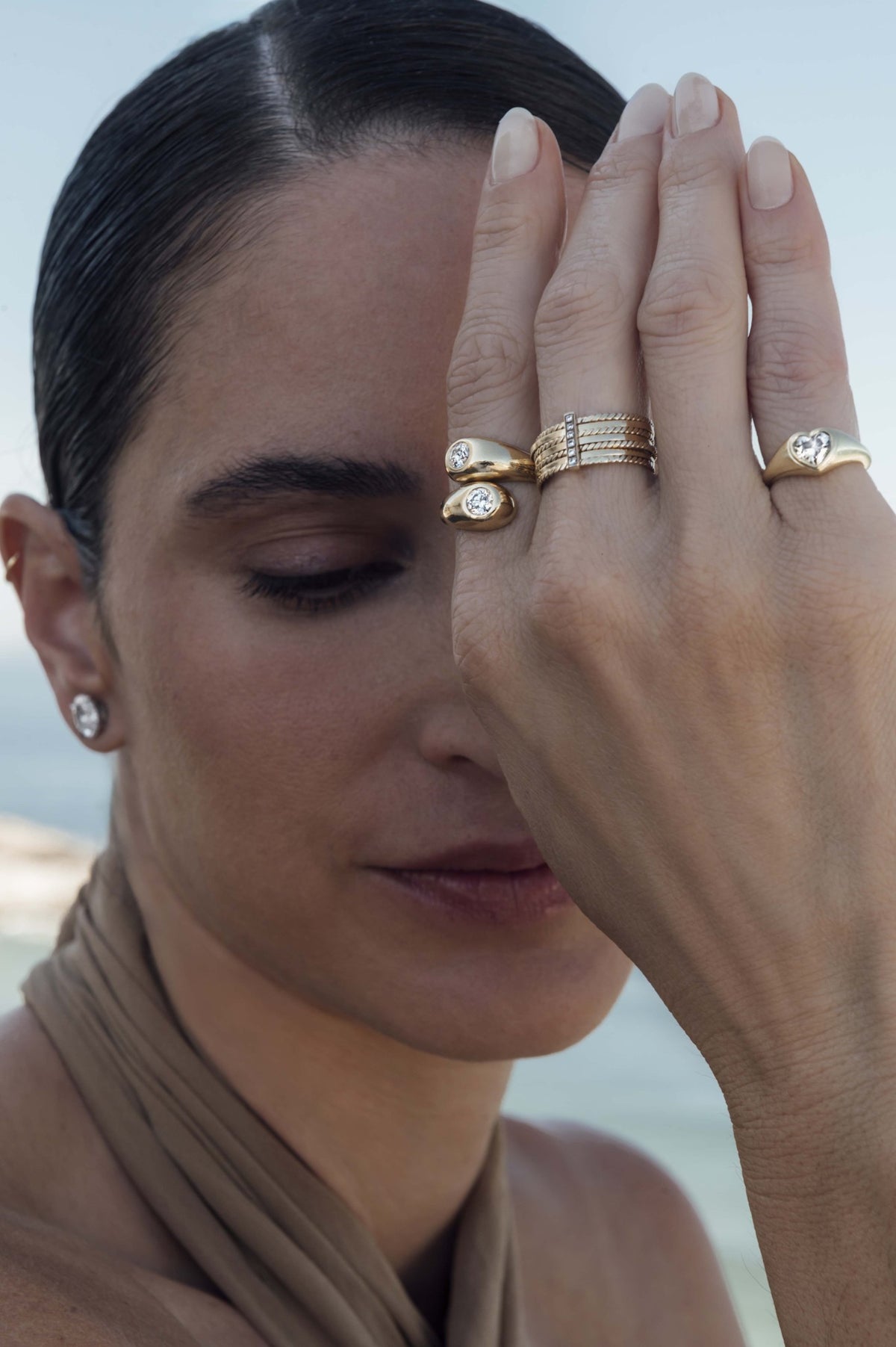 Bypass diamond cocktail ring in 18k yellow gold, worn on the hand