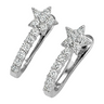 A pair of silver-toned huggie hoop earrings featuring a pavé-set starburst at the top and a curved pavé band, shown on a clean white background.